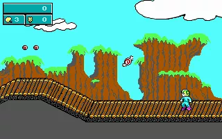 Commander Keen: Keen Dreams DOS Keen in his bunny slippers hopping around the first level of Tuberia (EGA)