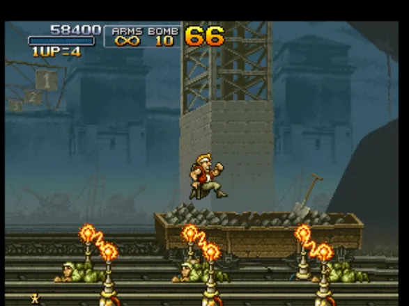 Metal Slug: Super Vehicle - 001 PlayStation Marco Rossi jumping over some electric barriers and crawling soldiers: he&#x27;ll continue the mission...