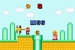 Mario Party-e Game Boy Advance Mario&#x27;s Mallet: ouch. Don&#x27;t hit Luigi.