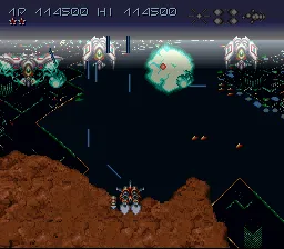 Axelay SNES Stage 3 - Flying over a desert and a large city